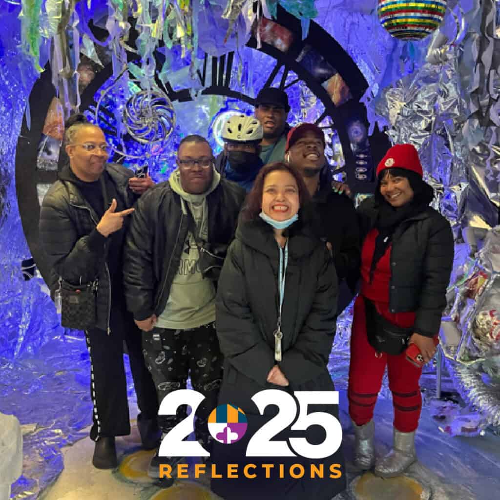 group of people smiling with a 2025 reflections text overlay